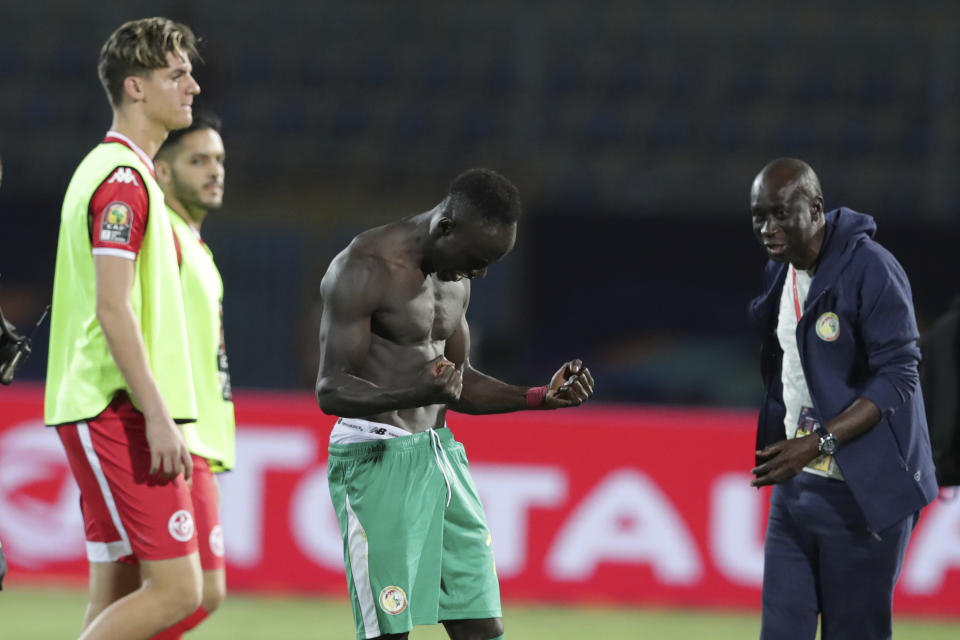 Senegal's Sadio Mane, center, celebrates end of the African Cup of Nations semifinal soccer match between Senegal and Tunisia in 30 June stadium in Cairo, Egypt, Sunday, July 14, 2019. (AP Photo/Hassan Ammar)