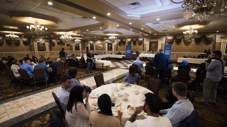 Audience members listen during the "How the Arab and Muslim Community Is Still Coping After 9/11" event at Byblos Banquet Hall in Dearborn, Michigan.