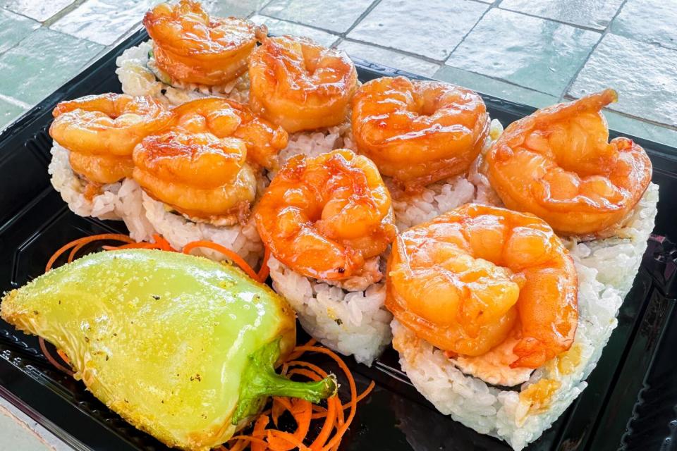 The Mochis roll, a California roll crowned with garlic shrimp.