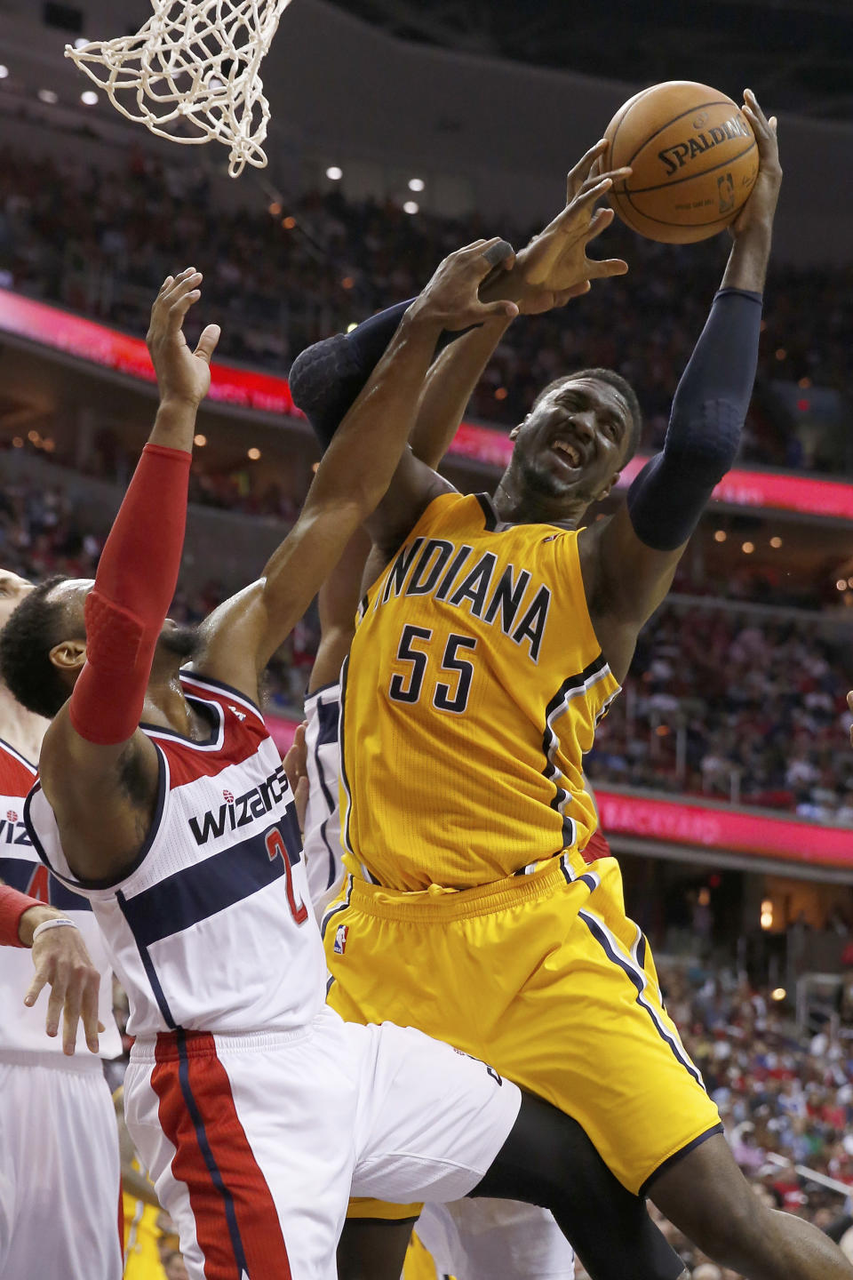 Indiana Pacers center Roy Hibbert (55) collides with Washington Wizards guard John Wall (2) under the basket during the second half of Game 4 of an Eastern Conference semifinal NBA basketball playoff game in Washington, Sunday, May 11, 2014. (AP Photo/Alex Brandon)