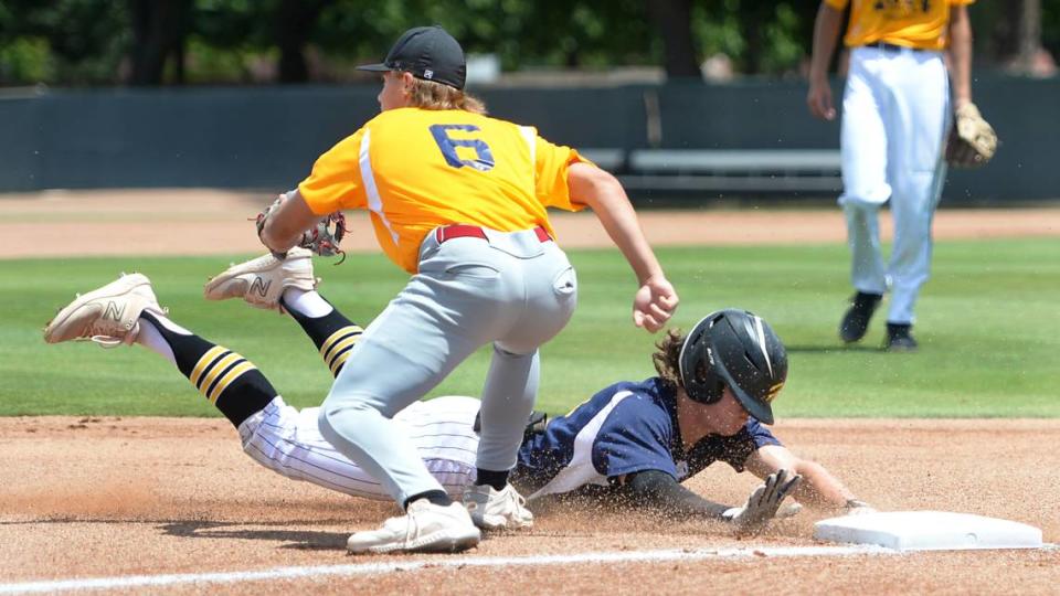 Hughson High senior Paul Wagner slides into third after hitting a triple during the 32nd Modesto Sunrise Rotary All-Star Game at CSU Stanislaus on Saturday, June 8, 2024.