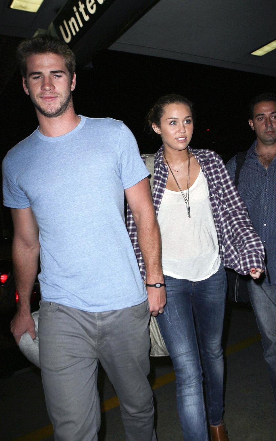 Los Angeles, June 15, 2010, Miley Cyrus&nbsp;and her boyfriend, Liam Hemsworth arrive at Los Angeles International Airport to catch a flight to New York.&nbsp;