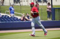 St. Louis Cardinals' Albert Pujols runs into the dugout before a spring training baseball game against the Washington Nationals, Wednesday, March 30, 2022, in West Palm Beach, Fla. (AP Photo/Sue Ogrocki)