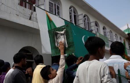 The Wider Image: Barricades and books in restive Kashmir neighbourhood