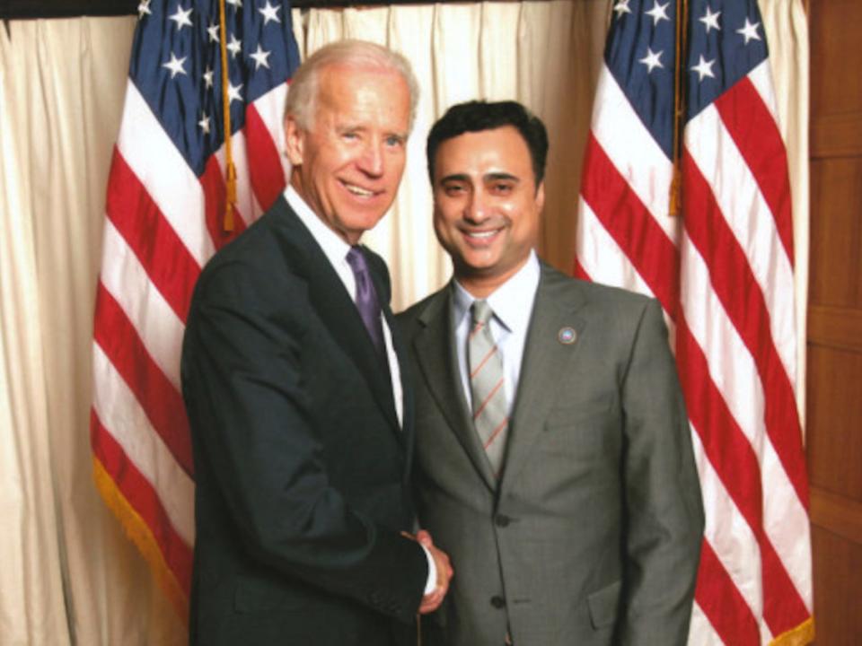 Imaad Zuberi, who faces 12 years in prison, shakes hands with then-Vice President Joe Biden.