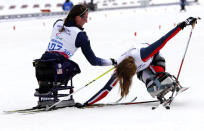 <div><span>HELPING HAND - Tatyana McFadden of the U.S. helps Norway's Birgit Skarstein (R) in the finish area during the women's 12 km cross-country sitting at the 2014 Sochi Paralympic Winter Games in Rosa Khutor.</span></div>