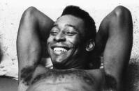 FILE - Brazilian soccer star Pele relaxes after a workout in Santos, Brazil, June 3, 1975. Pelé, the Brazilian king of soccer who won a record three World Cups and became one of the most commanding sports figures of the last century, died in Sao Paulo on Thursday, Dec. 29, 2022. He was 82. (AP Photo, File)