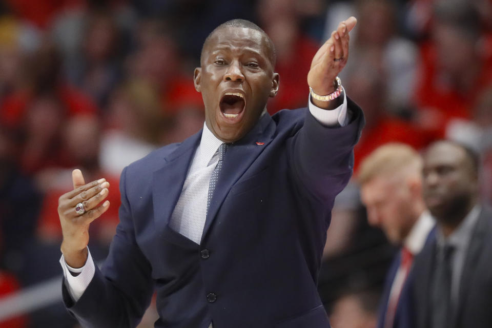 Dayton head coach Anthony Grand directs his players from the bench during the first half of an NCAA college basketball game against Massachusetts, Saturday, Jan. 11, 2020, in Dayton. (AP Photo/John Minchillo)