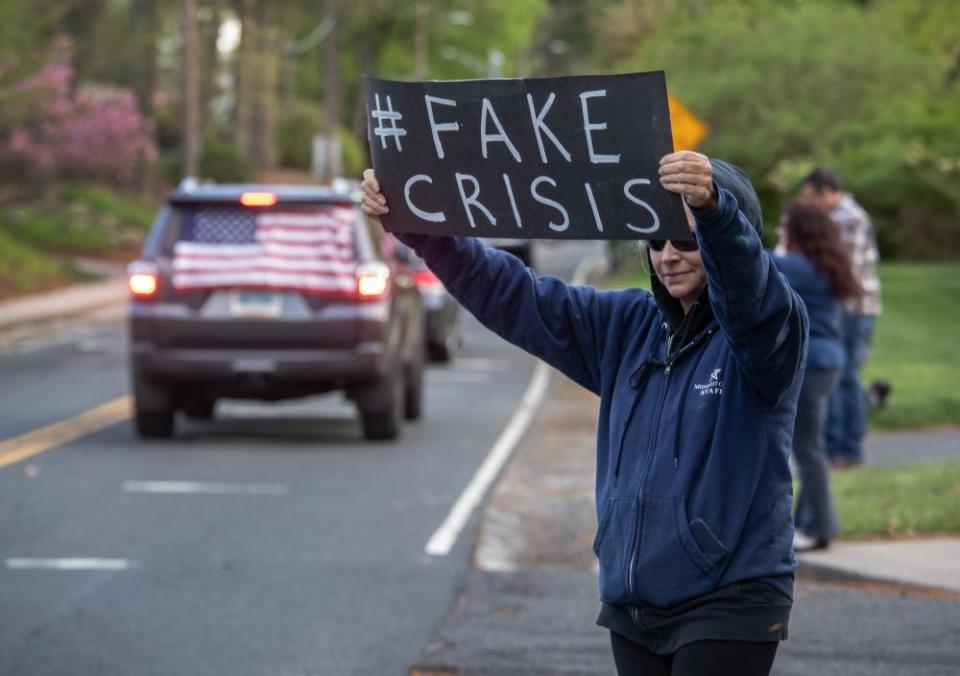 Demonstrators hold a ‘Rolling Car Rally’ in front of Connecticut governor Ned Lamont’s home in Hartford.