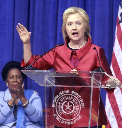 Democratic presidential candidate Hillary Clinton speaks after receiving the Barbara Jordan Public-Private Leadership Award during an appearance at Texas Southern University in Houston June 4, 2015. U.S. Rep Sheila Jackson Lee applauds at left. REUTERS/Donna Carson