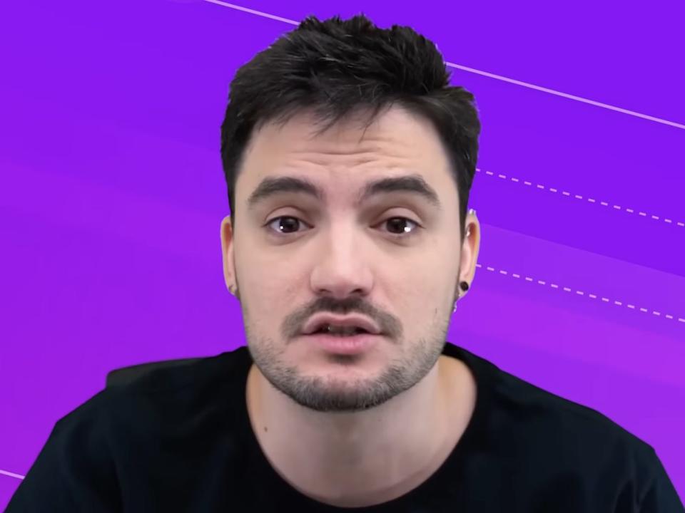 Screenshot from Felipe Neto's YouTube channel, wearing a black shirt in front of a purple background.