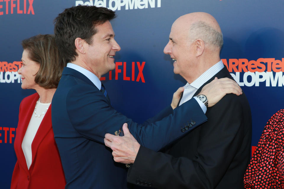 Jason Bateman made a point to give Jeffrey Tambor a big hug in front of photographers at the premiere of Netflix’s <em>Arrested Development</em> Season 5 on May 17. (Photo: Rich Fury/Getty Images)