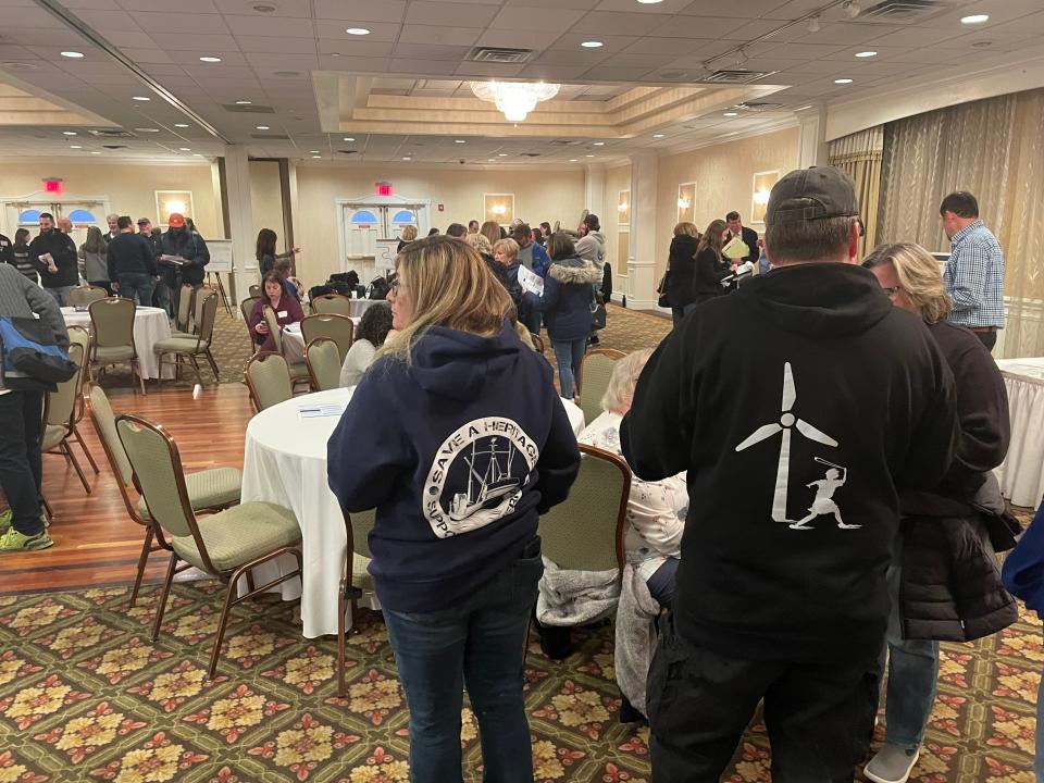 Attendees wear anti-offshore wind sweaters to a hearing held by the Bureau of Ocean Energy Management at the Clarion Hotel and Conference Center in Toms River on Thursday, Feb. 8, 2024.