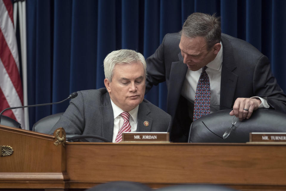 House Oversight and Accountability Committee Chairman James Comer, R-Ky., left, talks with Rep. Scott Perry, R-Pa., during the House Oversight and Accountability Committee's hearing about Congressional oversight of Washington, D.C., in Washington, Wednesday, March 29, 2023. (AP Photo/Cliff Owen)