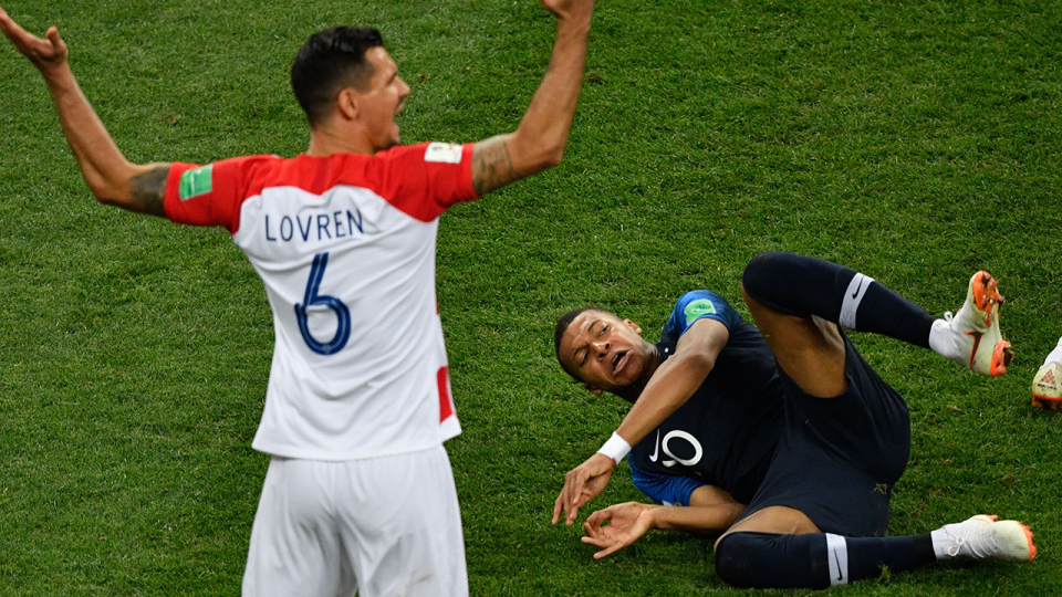 Lovren reacts to Kylian Mbappe falling to ground. Pic: Getty