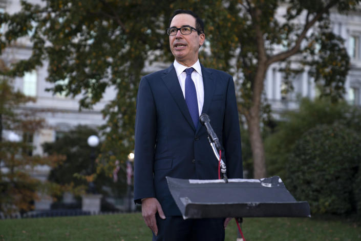 Treasury Secretary Steven Mnuchin talks with reporters about negotiations on another coronavirus stimulus package, outside the White House on Oct. 14, 2020, in Washington. (Evan Vucci/AP)