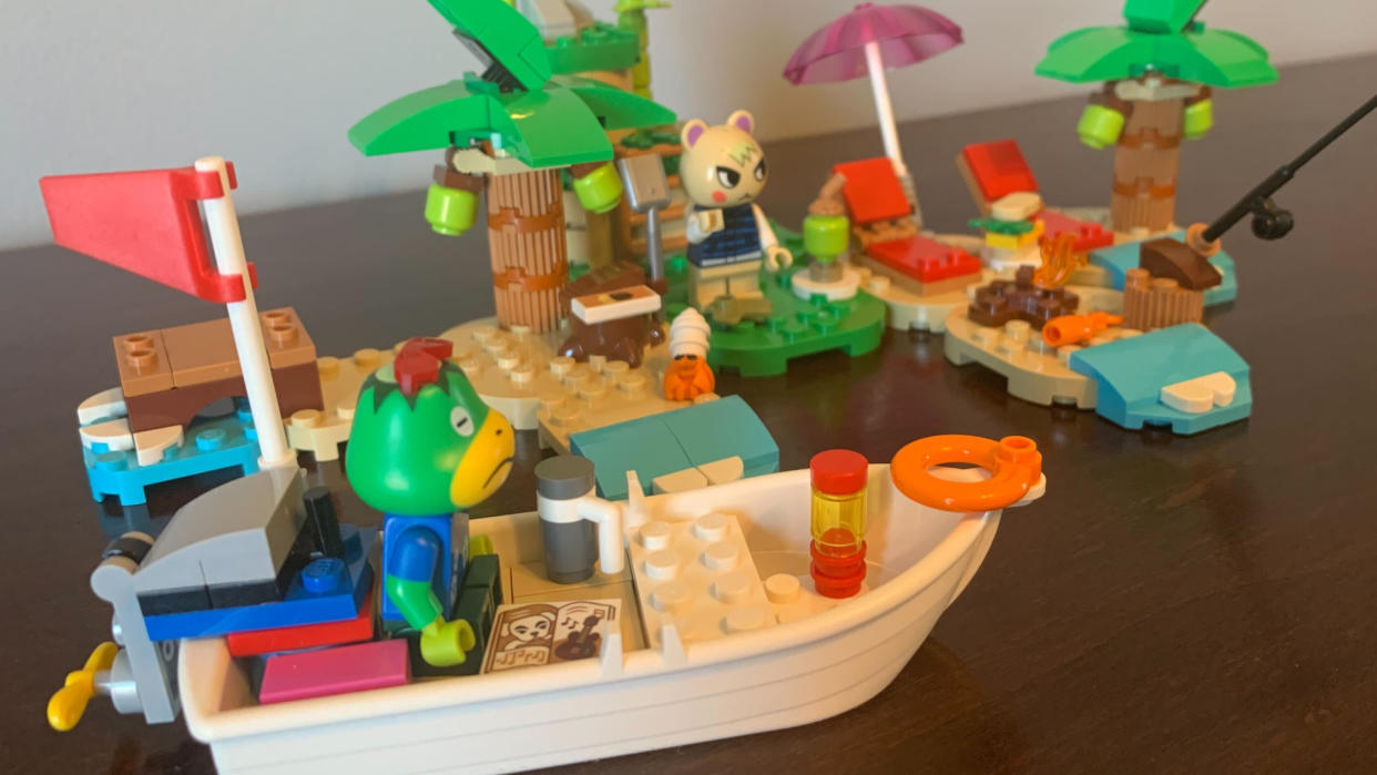  Lego Kapp'n's Island Boat Tour set on a wooden table. 