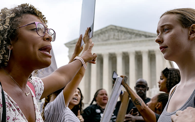 Protesters for and against abortion demonstrate outside the Supreme Court on June 27 in the aftermath of its decision to overturn Roe v. Wade. <em>Peter Afriyie</em>