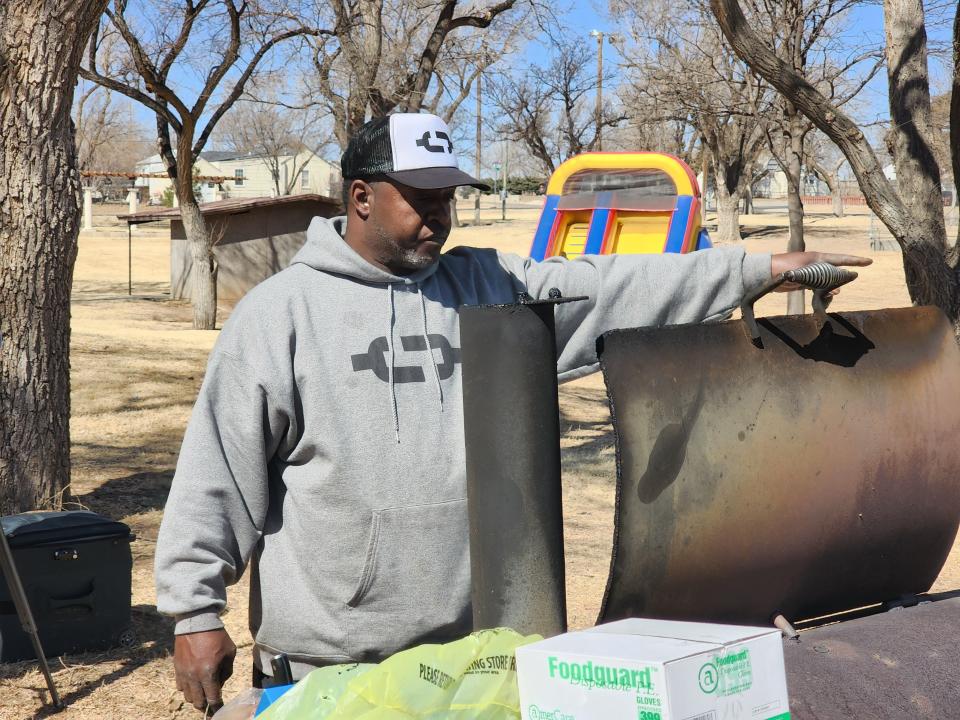 Tremaine Brown, owner of Shi Lee's BBQ and Soul Food, preps the grill at Bones Hooks Park to kick off his free lunch program available at multiple parks around the city in this 2022 file photo. Lunches will be offered throughout this year's spring break.