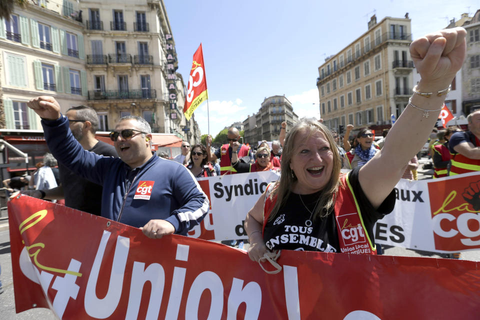 Public sector workers chant slogans during a demonstration in Marseille, southern France, Thursday, May 9, 2019. French unions are holding strikes and protests against 120,000 job cuts and other deep changes to France's huge public sector by President Emmanuel Macron's government. (AP Photo/Claude Paris)