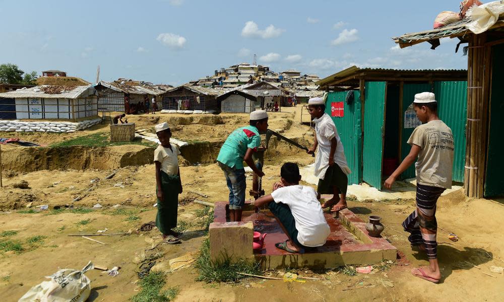 Rohingya men preparing to make an offering for afternoon prayers at the Cox’s Bazaar refugee camp.