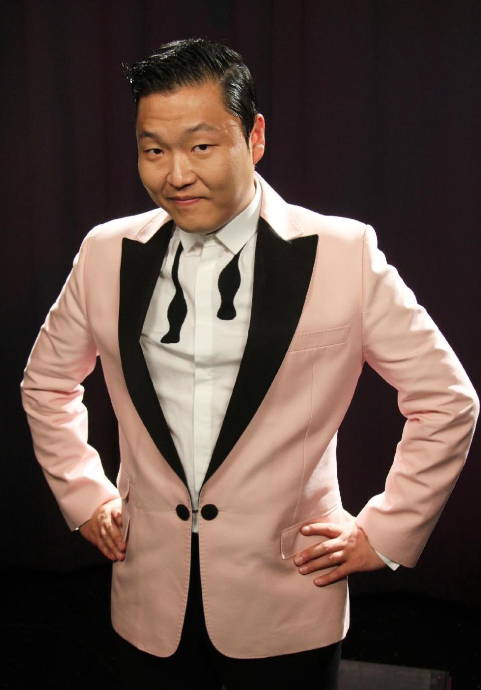 This Aug. 22, 2012 photo shows South Korean rapper PSY, born Jae-Sang Park, posing for a photo in New York. The music video for “Gangnam Style,” released last month, so far has garnered more than 49 million views on YouTube. The bright, vibrant clip features the comedic and flamboyant PSY delivering somewhat bizarre choreography while rapping and singing in Korean over a thumping, dance-flavored beat. It’s currently No. 1 on iTunes’ music videos chart. (AP Photo/John Carucci)