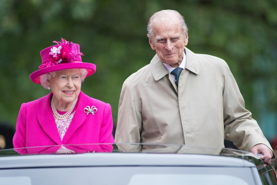 June 2016: Queen Elizabeth II in a bright pink outfit and Prince Philip in an overcoat