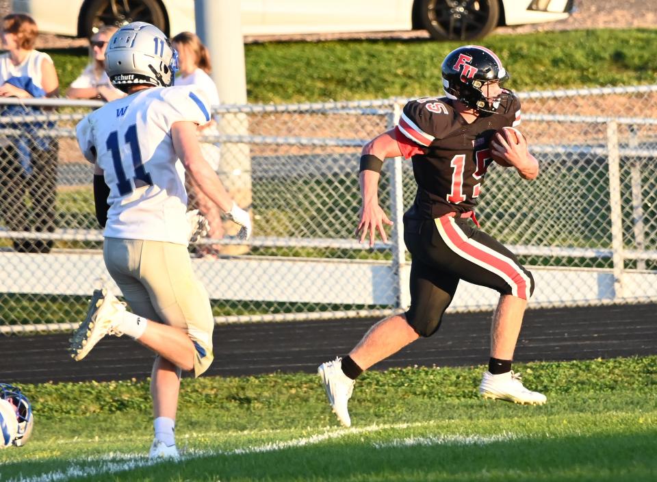 Fairfield Union's Owen Ruff runs for a touchdown during the 2nd quarter Friday night. The host Falcons defeated the Warren Warriors 42-3. -Jamie Potts/Eagle Gazette.