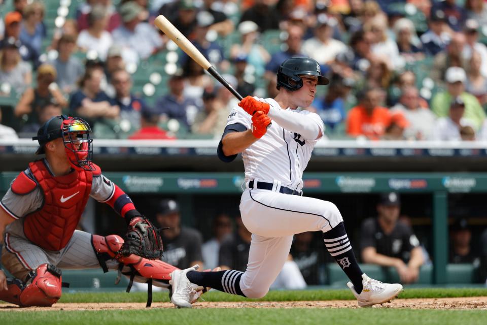 Detroit Tigers right fielder Kerry Carpenter (30) hits an RBI single in the third inning against the Minnesota Twins at Comerica Park in Detroit on Sunday, June 25, 2023.