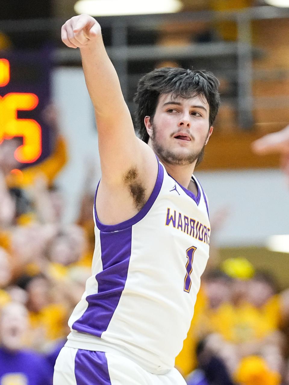 Scottsburg's guard Dare Bowles (1) scores a three-point basket Saturday, March 16, 2024, during the IHSAA Class 3A semi-state finals at Seymour High School in Seymour. Scottsburg defeated the Guerin Catholic Golden Eagles, 74-50.