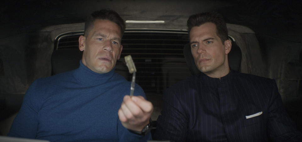 This image released by Apple shows John Cena, left, and Henry Cavill in a scene from "Argylle." (Apple-Universal Pictures via AP)