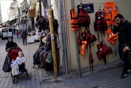 Life jackets are displayed for sale at a clothing shop on a main street in the Aegean port city of Izmir, western Turkey, in this March 7, 2016 file photo. REUTERS/Umit Bektas