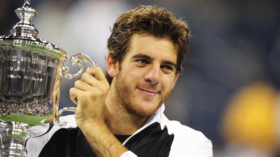 Seen here, Juan Martin del Potro holds the 2009 US Open trophy aloft.