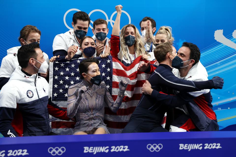 Madison Chock and Evan Bates of Team United States react to their score during the Ice Dance Free Dance Team Event (Getty Images)