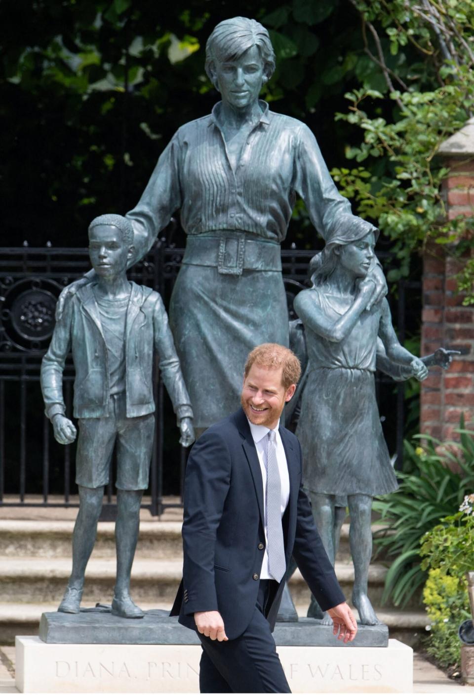 Prince Harry, Duke of Sussex gestures at the unveiling of a statue of his mother, Princess Diana