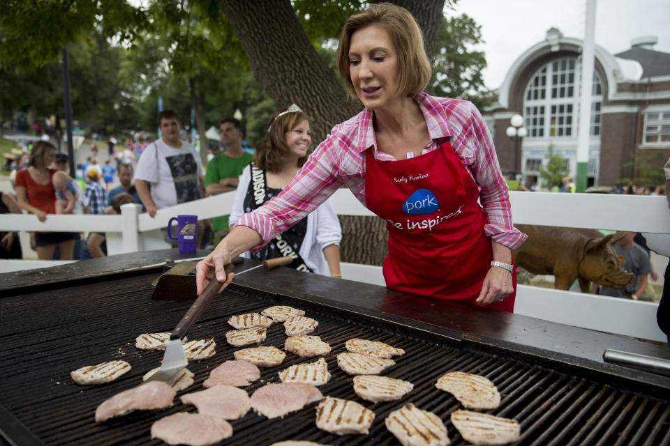 <p>Carly Fiorina flips pork loin at the Iowa Pork Producers Association stand.</p>