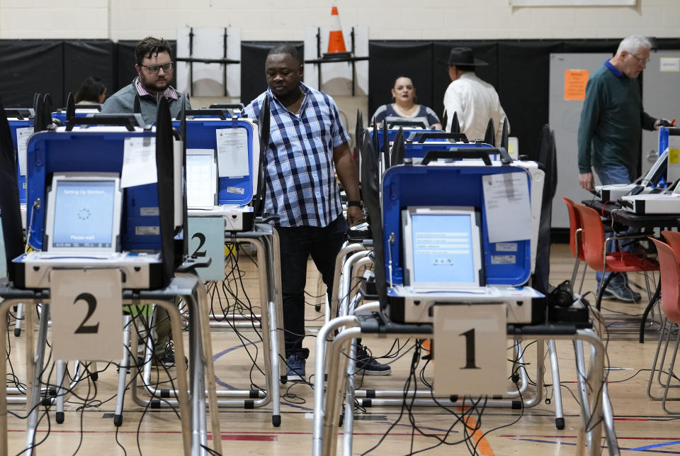 West Gray Multiservice Center election workers set up before the doors open for the general election, Tuesday, Nov. 7, 2023, in Houston. (Yi-Chin Lee/Houston Chronicle via AP)