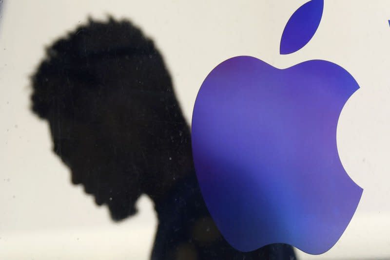 The Apple logo hangs outside of an Apple retail store in the SoHo Section of Manhattan in New York City in March. The next product launch is set for May 7. Photo by John Angelillo/UPI