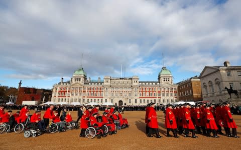 Veteran soldiers march across Horse Guards Parade before attending a National Service of Remembrance at The Centoph in Westminster, London - Credit: Reuters