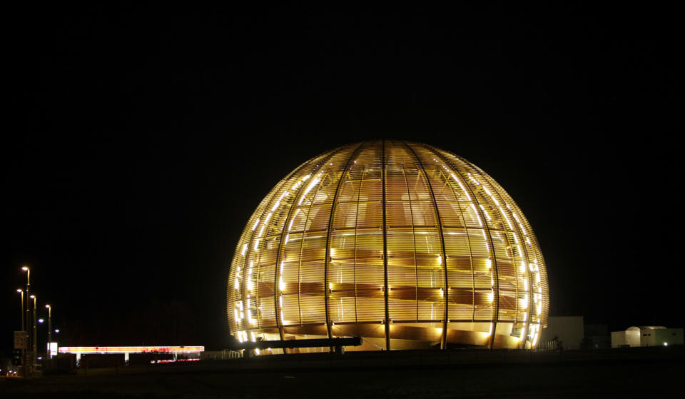 FILE - In this March 30, 2010 file picture the globe of the European Organization for Nuclear Research, CERN, is illuminated outside Geneva, Switzerland. With COVID-19, the race to space and climate change high on many minds, a new “do tank” in Geneva bankrolled by the Swiss government is gearing up to develop long-term projects like creating a global court for scientific disputes and a Manhattan Project-style effort to rid excess carbon from the atmosphere. (AP Photo/Anja Niedringhaus, file)