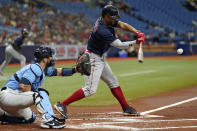 Boston Red Sox's Xander Bogaerts lines an RBI single off Tampa Bay Rays starting pitcher Rich Hill during the first inning of a baseball game Wednesday, June 23, 2021, in St. Petersburg, Fla. (AP Photo/Chris O'Meara)