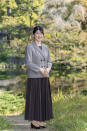 In this photo provided by the Imperial Household Agency of Japan, Princess Aiko, daughter of Emperor Naruhito and Empress Masako, strolls the garden of the Imperial Residence at the Imperial Palace in Tokyo on Nov. 14, 2021, ahead of her 20th birthday on Dec. 1, 2021. (The Imperial Household Agency of Japan via AP)