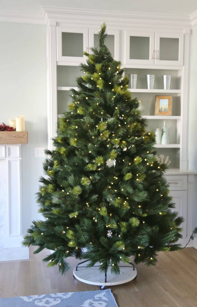 <p>A Christmas tree on wheels means you can move it wherever you need to around your house. It's ideal for photo ops!</p><p>See more at <a href="https://www.sandandsisal.com/2016/11/diy-mobile-christmas-tree-stand.html" rel="nofollow noopener" target="_blank" data-ylk="slk:Sand and Sisal;elm:context_link;itc:0;sec:content-canvas" class="link ">Sand and Sisal</a>.</p>