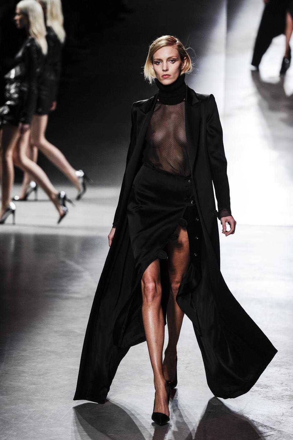 A model wears a creation for Antony Vaccarello's ready to wear fall/winter 2014-2015 fashion collection presented in Paris, Tuesday, Feb. 25, 2014. (AP Photo/Zacharie Scheurer)