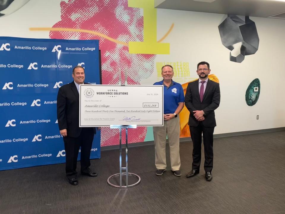 Alberto Treviño III, Commissioner of the Texas Workforce Commission, left, stands with Amarillo College Board of Regents Chairman Jay Barrett, center, and Dr. Frank Sobey, AC Vice President of Strategic Initiatives, right, during a check presentation Wednesday morning at the college. AC received a $331,268 grant from TWC to enhance its welding program.