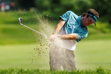 Jun 26, 2015; Cromwell, CT, USA; Bubba Watson hits out of a bunker on the 13th hole in the second round at TPC River Highlands. Mandatory Credit: David Butler II-USA TODAY Sports