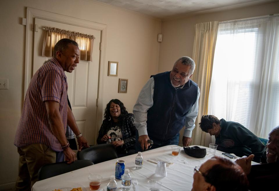 Chris Diggs jokes with William F. Tucker during a family birthday party in Hampton, Virginia.