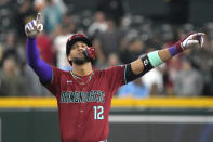 Arizona Diamondbacks' Lourdes Gurriel Jr. reacts after hitting an RBI double against the Colorado Rockies during the fifth inning of a baseball game Sunday, March 31, 2024, in Phoenix. (AP Photo/Rick Scuteri)