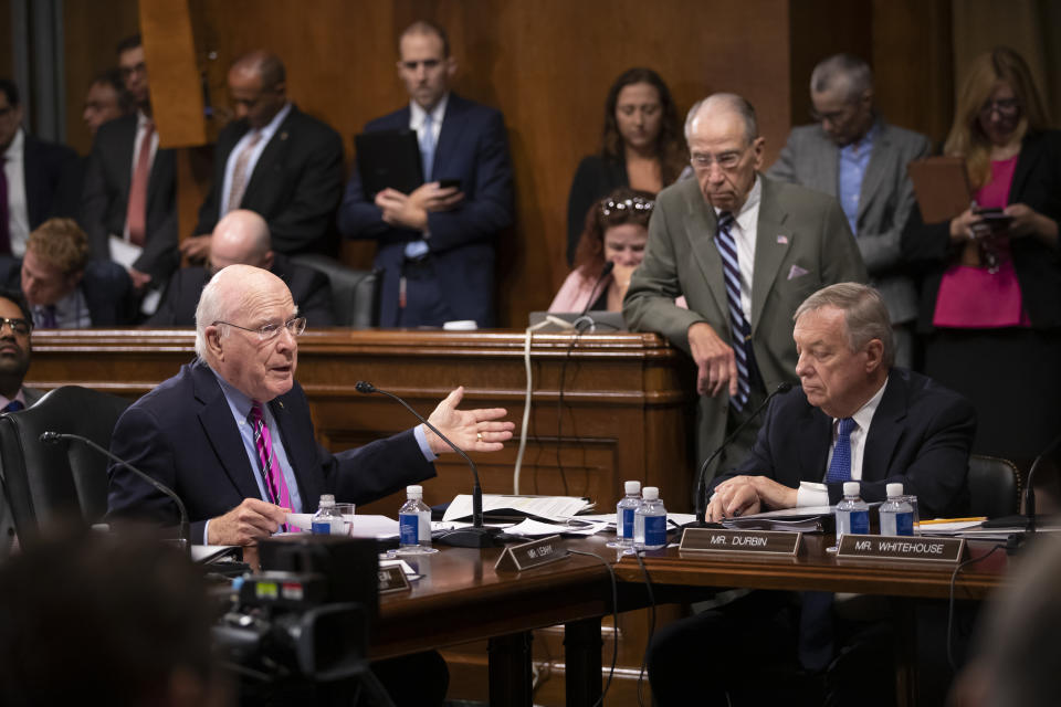 Sen. Patrick Leahy, D-Vt., left, a former chairman of the Senate Judiciary Committee, appeals to other members Sen. Chuck Grassley, R-Iowa, standing right, and Sen. Dick Durbin, D-Ill., asking Committee Chairman Lindsey Graham, R-S.C., not to break with normal rules of procedure as Graham tries to change asylum laws as a way to address the migrant crisis at the southern border, but without input from the Democrats, on Capitol Hill in Washington, Thursday, Aug. 1, 2019. (AP Photo/J. Scott Applewhite)