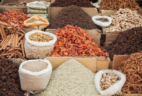 Spices at a market in India - Credit: AP